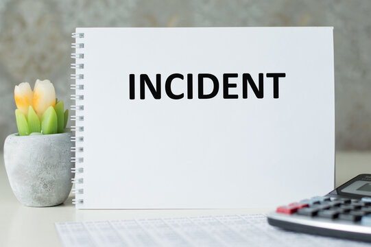 INCIDENT inscription on a notebook on a table, a business concept