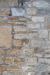 Irregular and brown stone wall texture