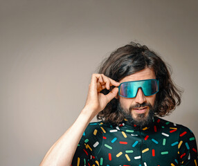 Young man wearing sunglasses in studio
