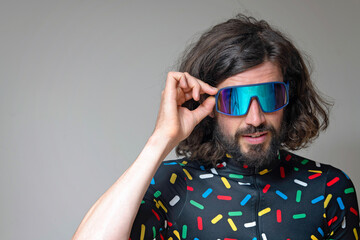 Young man wearing sunglasses in studio