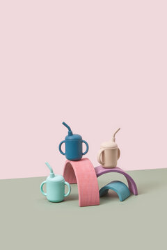 Silicone kids cups balancing on wooden planks