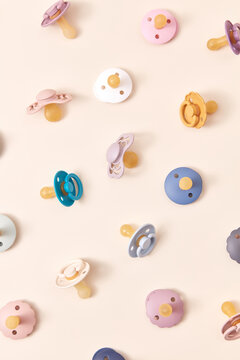 Pattern of colorful dummies for newborn.