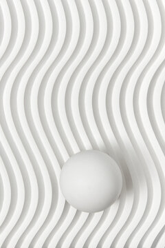 Fototapeta White ribbed background with sphere on top.