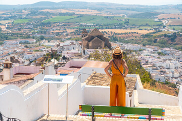 A tourist looking at the tourist town of Arcos de la Frontera in Cadiz, Andalucia