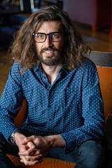 Young professional man at work wearing glasses