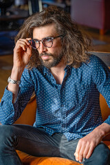 Young professional man at work wearing glasses
