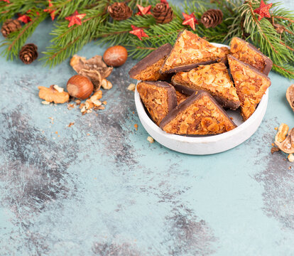 Nut corner triangles, traditional german sweets called Nussecke, covered with chocolate, christmas cake
