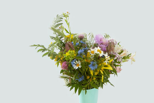 Flowers and herbs in rubber boot.