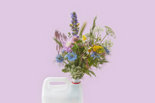 Wildflowers in white plastic canister.