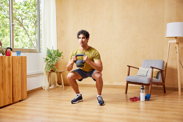 Determined sportsman exercising with kettlebell