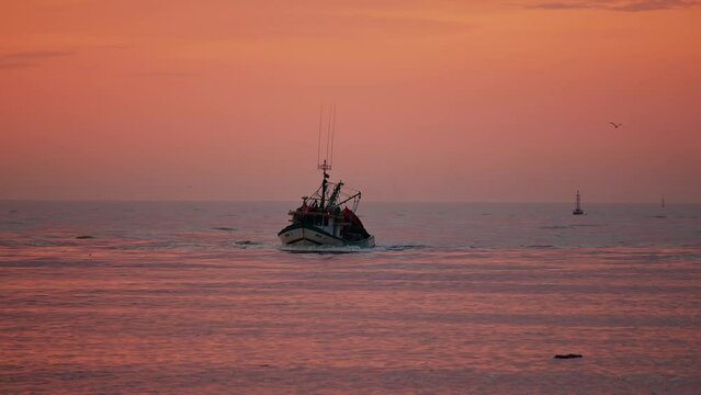 Fishing boat returned from the sea at sunrise, Itaja&iacute; - Santa Catarina