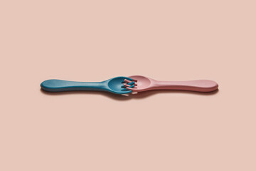 Small silicone forks of blue and pink colors