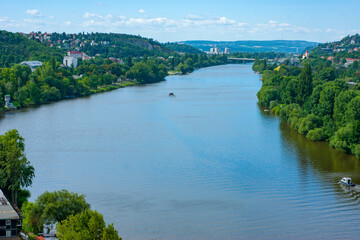 Modern day skyline with Vltava River and beyond in Prague in the Czech Republic looking toward the Bohemian countryside. Photo taken from Vysehrad ramparts.   