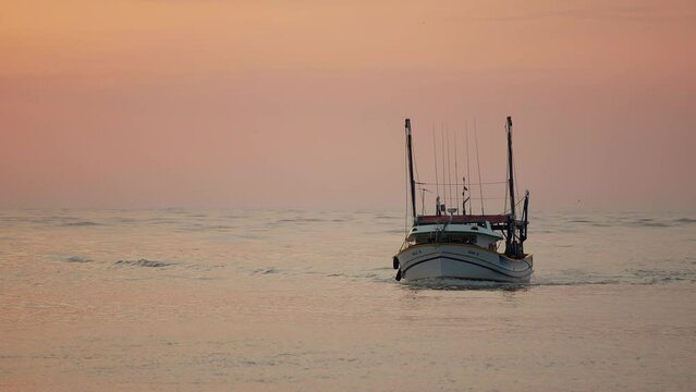 Fishing boat returned from the sea at sunrise, Itaja&iacute; - Santa Catarina
