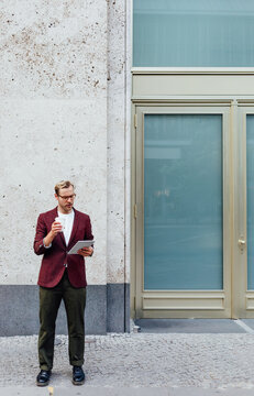 Man Dinking Coffee in Street