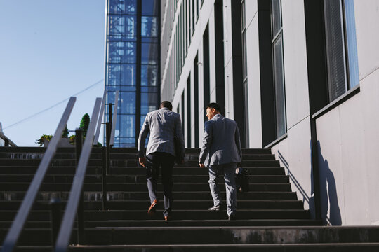 Employees In Suits On Stairs 