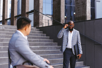 Worker bidding farewell with workmate 
