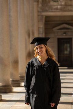  Portrait of brunette Young college graduate with mortarboard 
