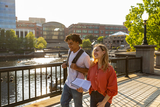 Two cute Friends University Students in city strut on campus 