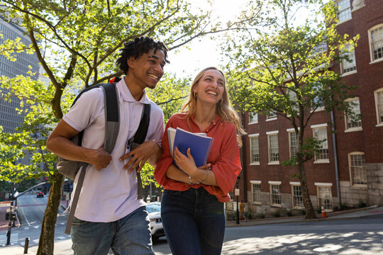 City college students walking together on campus 