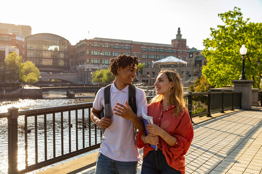 Two cute Friends University Students discuss homework 