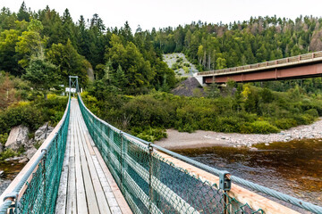 Fototapeta na wymiar Big Salmon River Suspension Bridge view in Fundy national park