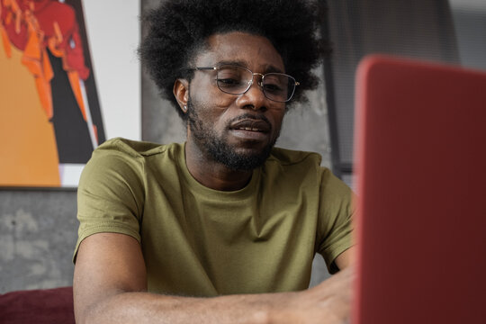 Black Freelancer Considering Options During Video Call