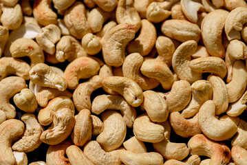 Cashew nuts on a dark stone background