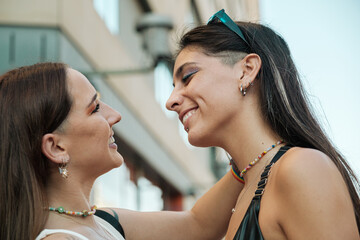 Lesbian couple in love looking each other 