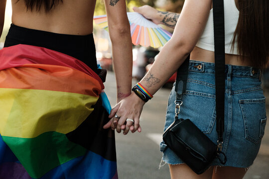 Anonymous lesbian couple holding hands