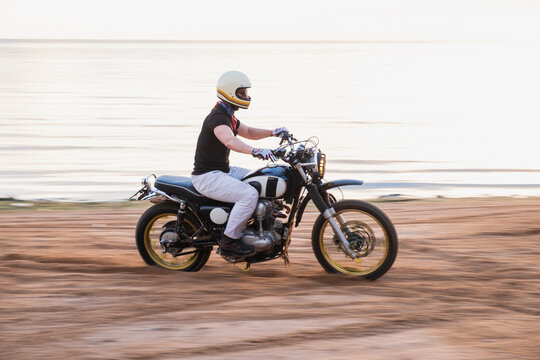 Rider Ride A Motorcycle Fast On The Beach