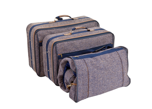 Vintage blue tweed suitcases isolated. 
