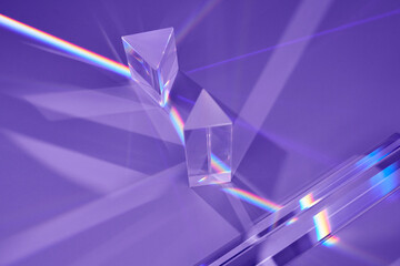 Triangular prisms with light producing spectrum.
