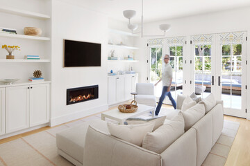 Person walking in modern design interior farmhouse living room 