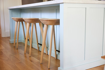 Wood bar stools at kitchen island
