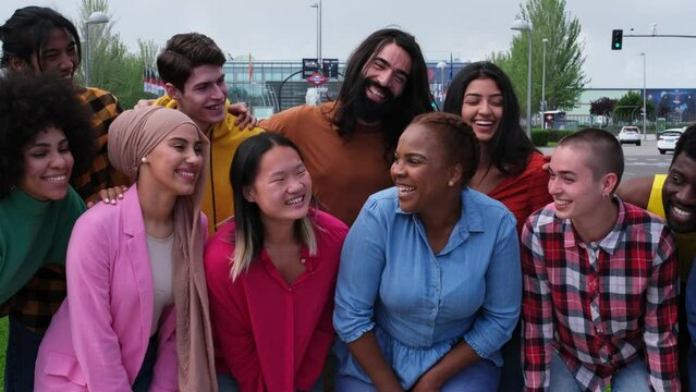 Group of friends from different cultures together claiming lgtbi+ pride