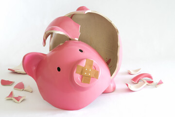 Piggy bank symbol of inflation, economy and crisis. Pink coloured on white background