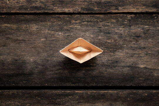 Top View Of An Origami Boat Made Of Polka Dot Paper