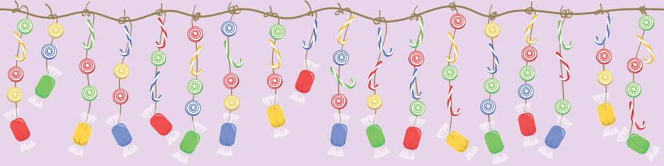 Sweets and candies on a rope on a pink background, horizontal banner