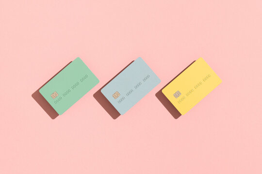 Pastel credit / debit cards on pink background