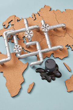 Oil pipeline over map with spilled petroleum.