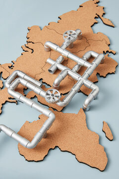 Gas piping over cork world map.