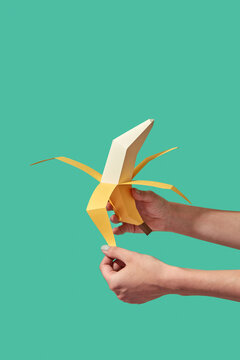Paper craft banana peeled by woman.