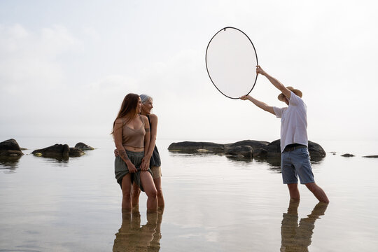 Making of woman daughter portrait at beach