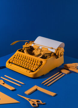 Old yellow typing machine .