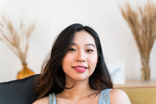 Portrait of an Asian woman at home.