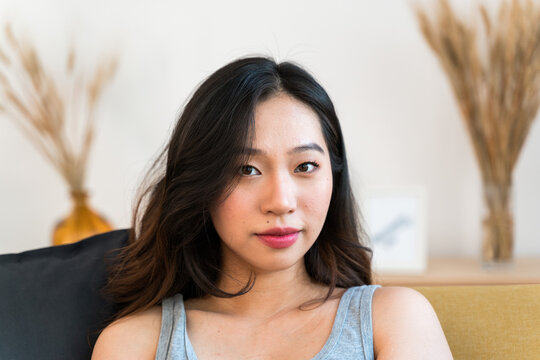 Portrait of an Asian woman at home.