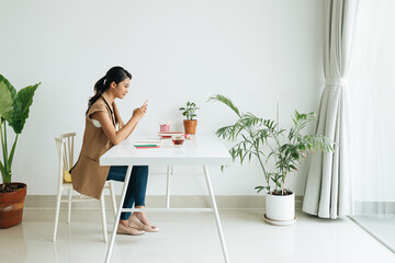 Female student using smartphone online learning in application
