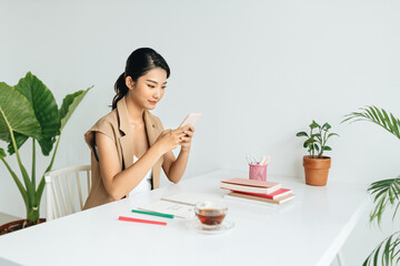 Intelligent female student writing informative text