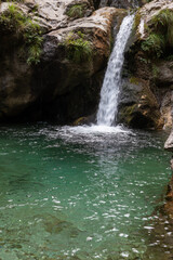 Fototapeta na wymiar Val Vertova waterfalls, Italy. Waterfalls with clear and clean water.